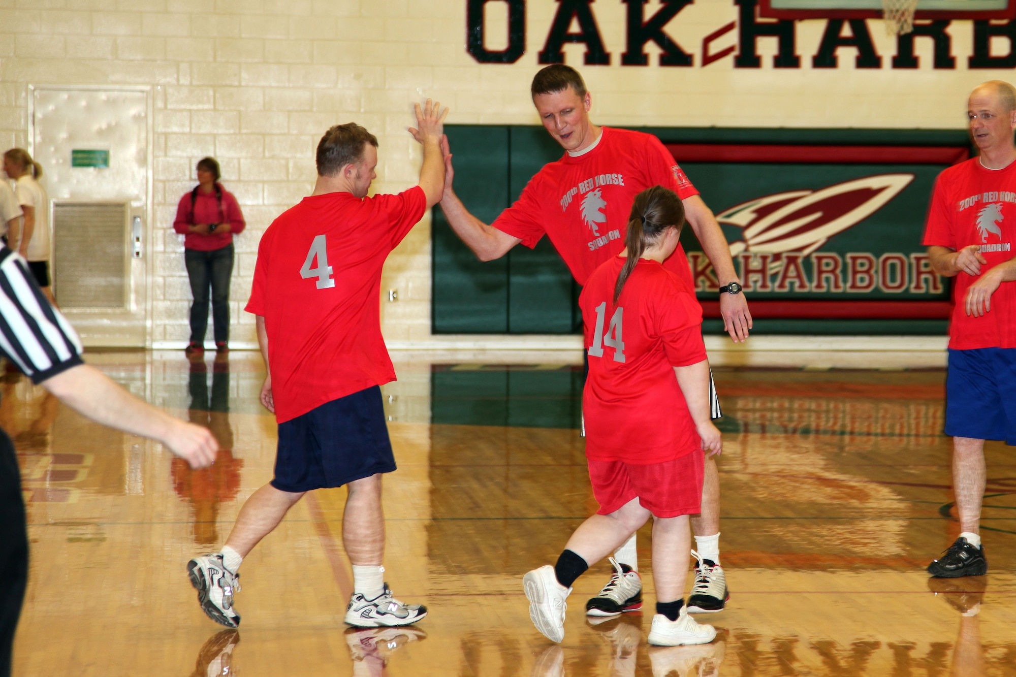 1st Lt. Jason Askins congratulates Special Olympian Lyle Overmyer on his great shot during the Ottawa County Board of Developmental Disabilities basketball tournament, Camp Perry, OH, Mar. 23, 2015. 200 RED HORSE sponsored a five member team along with two Special Olympic players participated in three, 12 minute games, at Oak Harbor High School Auditorium to support the United Way of Ottawa County.(U.S. Air National Guard Photo by Master Sgt. Lisa Haun\Released)
