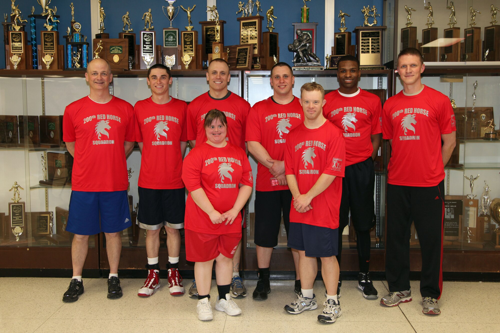 Members of the 200 RED HORSE participates in the Ottawa County Board of Developmental Disabilities basketball tournament, Camp Perry, OH, Mar. 23, 2015. A five member team along with two Special Olympic players participated in three, 12 minute games, at Oak Harbor High School Auditorium to support the United Way of Ottawa County.Back row Left to right; Tech. Sgt. Daryl Walters, Nate Walters, Tech. Sgt. Travis Swihart, Staff Sgt. Terry Broshious, Senior Airman Joseph Hall, and 1st Lt. Jason Askins. Front Row, left to right; Heather Blausey and Lyle Overmyer.  (U.S. Air National Guard Photo by Master Sgt. Lisa Haun\Released)
