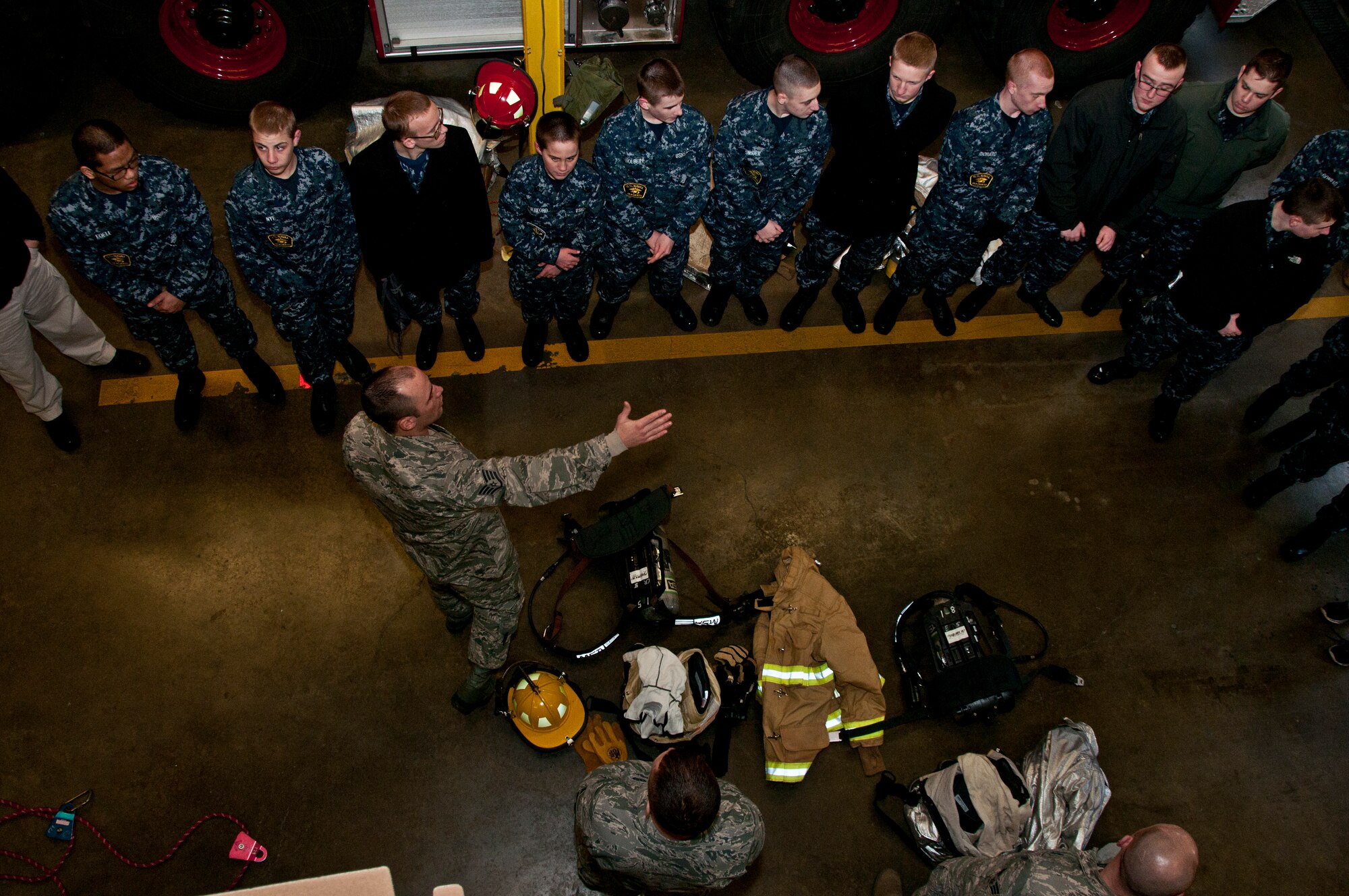 Members of the 179th Airlift Wing fire department give a tour to the U.S. Naval Sea Cadets Corps as they visited the 179th Airlift Wing, Mansfield, OH, March 08, 2014.  The cadets got a chance to tour a C-130H Hercules as well the fire department. Members of the Aircrew Flight Equipment section also gave a demonstration on night vision goggles, land and water survival kits. (U.S. Air National Guard Photo by Tech. Sgt. Joe Harwood\Released)
