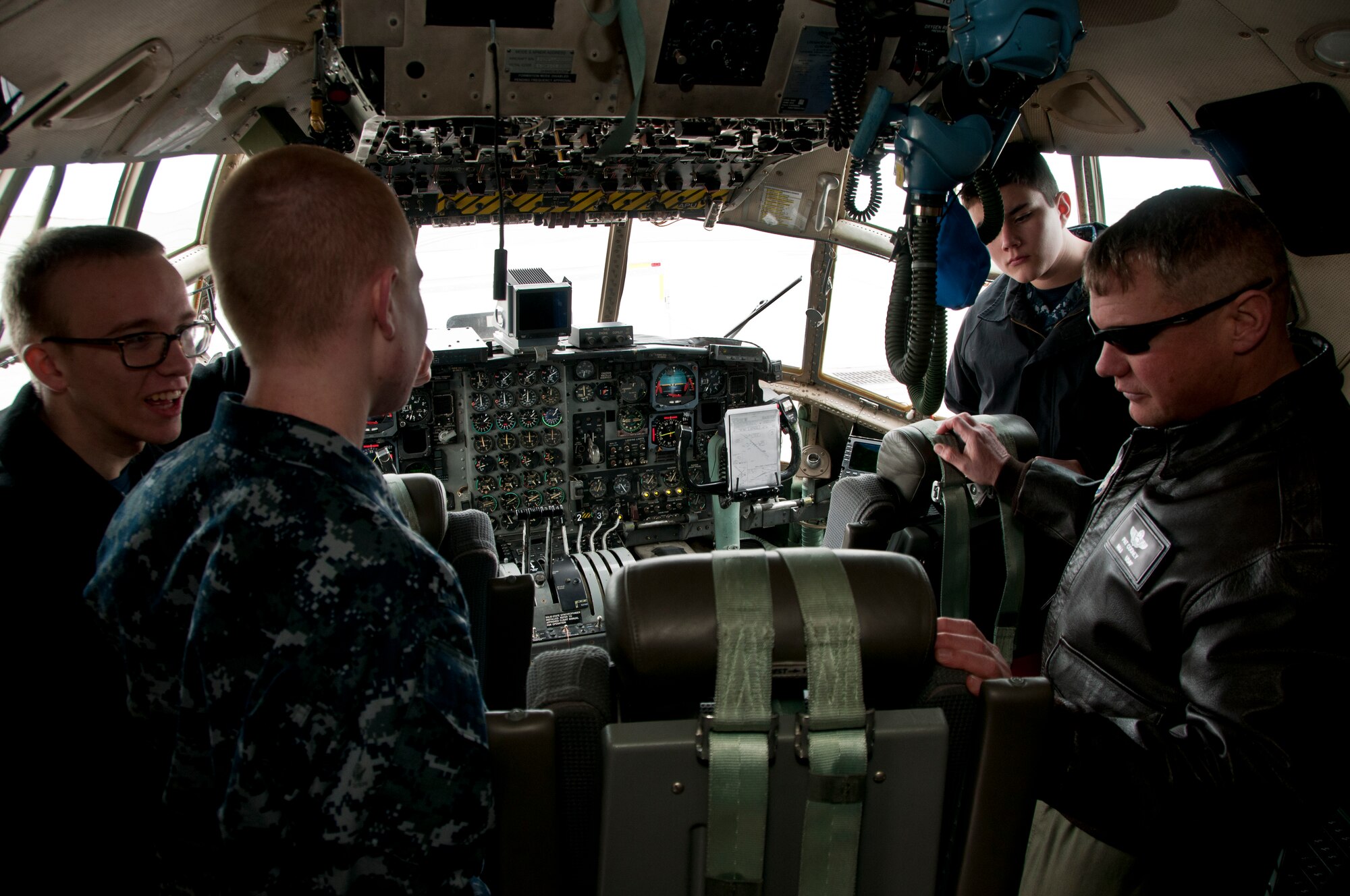 179th Airlift Wing aircrew member, Maj. Pat Cooney, speaks to the U.S. Naval Sea Cadets Corps during their visit to the 179th Airlift Wing, Mansfield, OH, March 08, 2014.  The cadets got a chance to tour a C-130H Hercules as well the fire department. Members of the Aircrew Flight Equipment section also gave a demonstration on night vision goggles, land and water survival kits. (U.S. Air National Guard Photo by Tech. Sgt. Joe Harwood\Released)