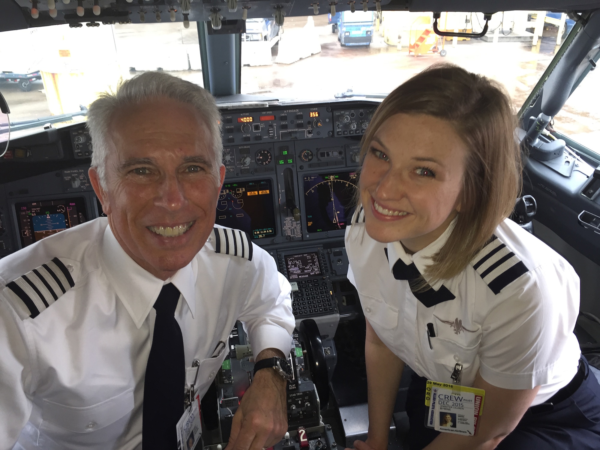 Capt. Jennifer Byrne, a C-17 pilot with the 89th Airlift Squadron, flew a commercial flight with her dad, Scott Byrne, to Texas then on into California March 18, 2015. Both are pilots for American Airlines. (Courtesy photo)