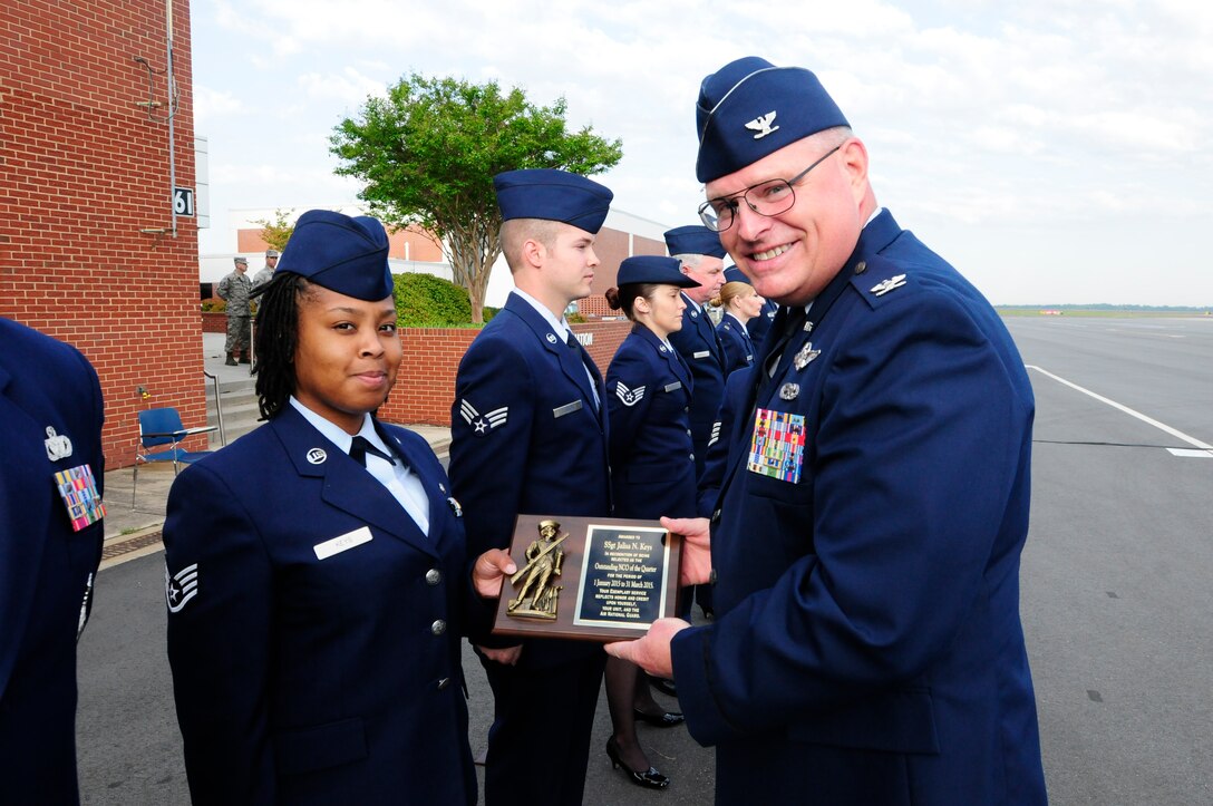 U.S. Air Force Staff Sgt. Jalisa Keys, NCANG, 145th Operations Support Squadron, receives recognition for NCO of the Quarter for the period January-March 2015 during a ramp formation held at the North Carolina Air National Guard Base, Charlotte Douglas Intl. Airport May 3, 2015. A ramp formation is when units assigned to the 145th Airlift Wing form up quarterly to honor award winners and medal recipients. It also gives U.S. Air Force Col. Marshall Collins, 145th Airlift Wing commander, an opportunity to address his airmen. (U.S. Air National Guard photo by Senior Airman Laura Montgomery, 145th Public Affairs/Released)