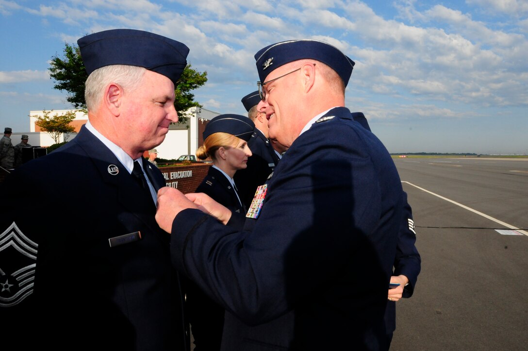 U.S. Air Force Chief Master Sgt. Gregory Trantham, 145th Maintenance Squadron, receives Meritorious Service Medal for his role as the maintenance systems Chief Enlisted manager, as well as a North Carolina Meritorious Service Medal for his 36 years of service during a ramp formation held at the North Carolina Air National Guard Base, Charlotte Douglas Intl. Airport May 3, 2015. A ramp formation is when units assigned to the 145th Airlift Wing form up quarterly to honor award winners and medal recipients. It also gives U.S. Air Force Col. Marshall Collins, 145th Airlift Wing commander, an opportunity to address his airmen.  (U.S. Air National Guard photo by Senior Airman Laura Montgomery, 145th Public Affairs/Released