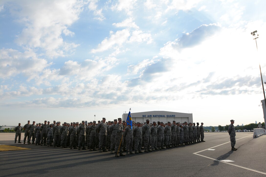 U.S. Air Force members from the 145th Maintenance Group stand in formation during a ramp formation held at the North Carolina Air National Guard Base, Charlotte Douglas Intl. Airport May 3, 2015. A ramp formation is when units assigned to the 145th Airlift Wing form up quarterly to honor award winners and medal recipients. It also gives U.S. Air Force Col. Marshall Collins, 145th Airlift Wing commander, an opportunity to address his airmen. (U.S. Air National Guard photo by Staff Sgt. Julianne M. Showalter, 145th Public Affairs/Released)