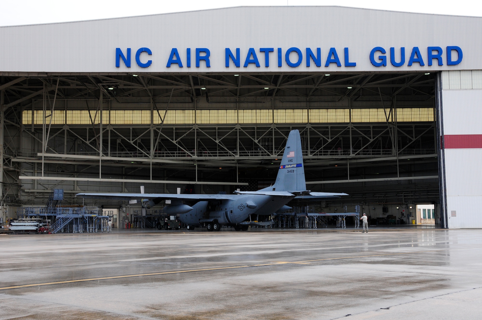 A 145th Airlift Wing, C-130 Hercules aircraft is towed into a maintenance hangar at the North Carolina Air National Guard base, Charlotte Douglas International Airport, June 2, 2015. This C-130 is the first aircraft that maintainers will work on utilizing the long awaited Isochronal Inspection (ISO) Aircraft Maintenance Platforms that arrived May 23, 2015. These stands will improve overall safety for maintenance personnel and provide the maintainers better access to all parts of the C-130. (U.S. Air National Guard photo by Master Sgt. Patricia F. Moran, 145th Public Affairs/Released)