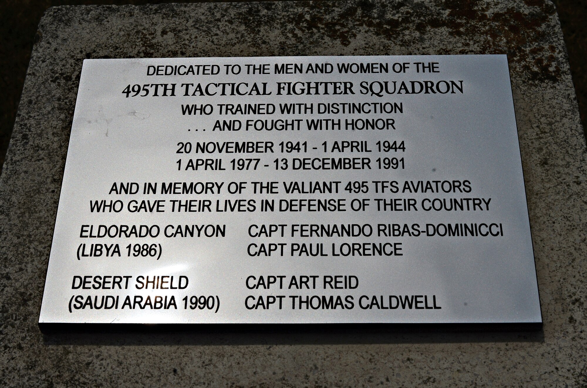 A new plaque dedicated to Royal Air Force Lakenheath’s deactivated 495th Tactical Fighter Squadron, was placed on a time capsule memorial at RAF Lakenheath, England, June 19, 2015. Activated in 1977, the squadron functioned as a replacement training unit for the Liberty Wing’s 492nd, 493rd and 494th Fighter Squadrons that are active today. (U.S. Air Force photo by Senior Airman Erin O’Shea/Released)