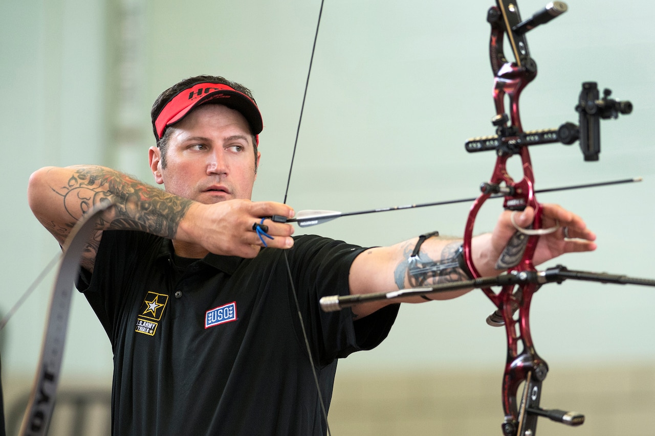 Retired Army Staff Sgt. Billy Meeks aims an arrow during the archery competition of the Army trials at Fort Bliss, Texas, March 31, 2015. Athletes in the trials competed for spots on the Army’s team in the 2015 DoD Warrior Games at Marine Corps Base Quantico, Va. DoD News photo by EJ Hersom