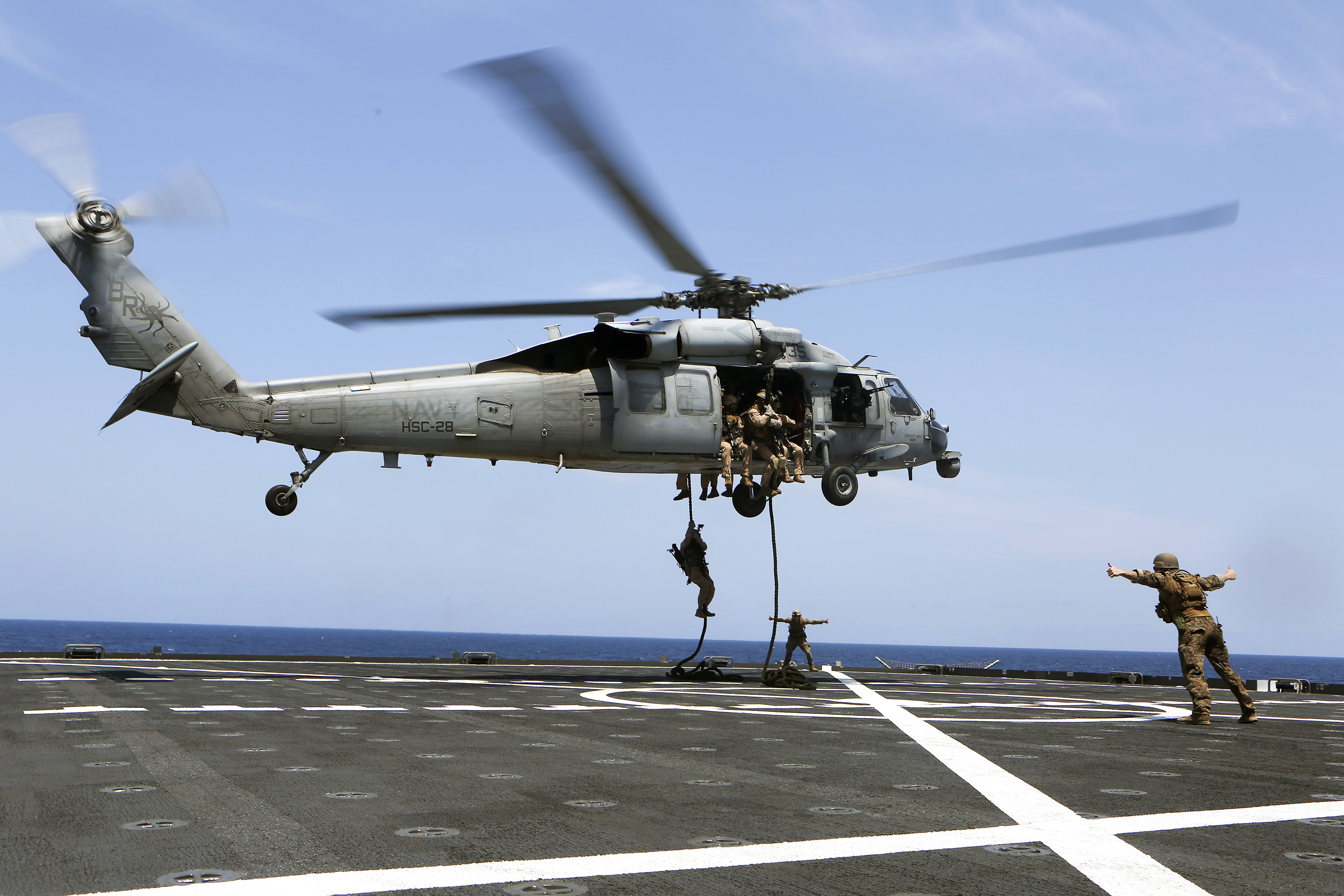 U S Marines Fast Rope From A Sh 60 Seahawk Helicopter While Conducting Visit Board Search And U S Marines Fast Rope From A Sh 60 Seahawk Helicopter While Conducting Visit Board Search And