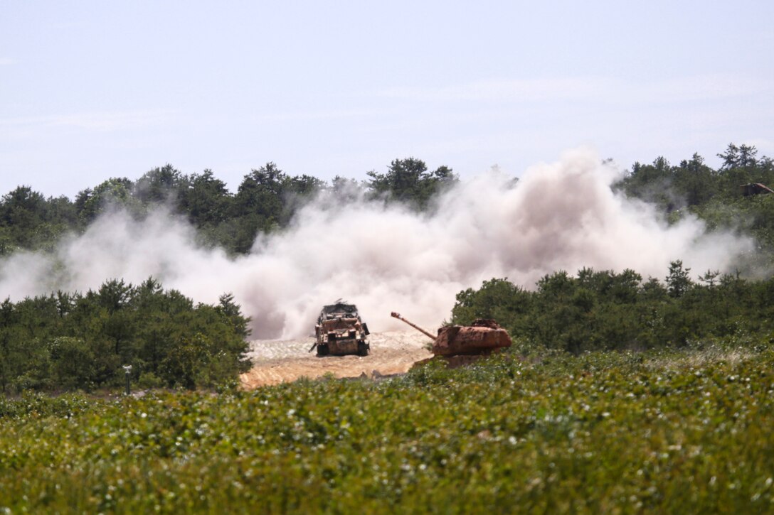Enemy tank targets are strafed by a Maryland Air National Guard A-10 Thunderbolt II during a close air support exercise as part of Operation Morning Coffee at Warren Grove Gunnery Range, N.J., June 17, 2015.
