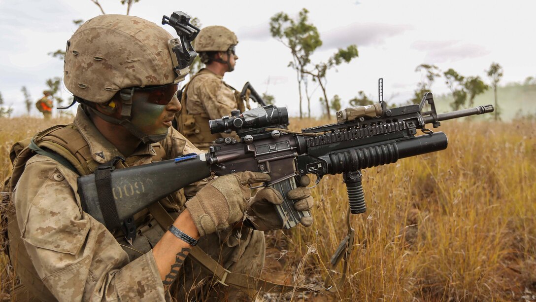 A U.S. Marine with Company C, 1st Battalion, 4th Marine Regiment, Marine Rotational Force – Darwin, fires his M203 40mm grenade launcher during a brigade assault as part of Exercise Southern Jackaroo June 13 at Townsville Field Training Area, Queensland, Australia. SJ15 was a combined training opportunity for the Marines with MRF-D and their Australian allies that helped to improve interoperability between the two forces. The U.S. Marine Corps and the Australian Defence Forces are committed to continuing their tradition of more than 100 years of global partnership and security cooperation between Australia and the United States of America. 