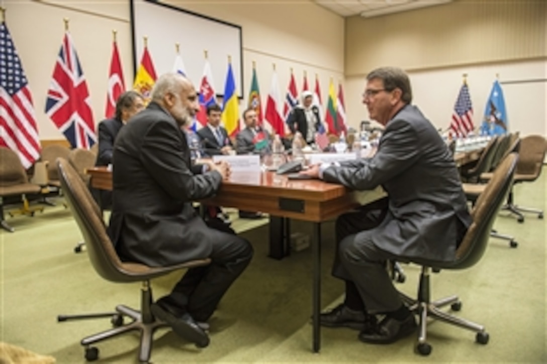 U.S. Defense Secretary Ash Carter meets with Afghan Acting Defense Minister Masoom Stanekzai at NATO headquarters in Brussels, June 25, 2015, to discuss matters of mutual importance. Carter is participating in his first NATO ministerial as defense secretary.