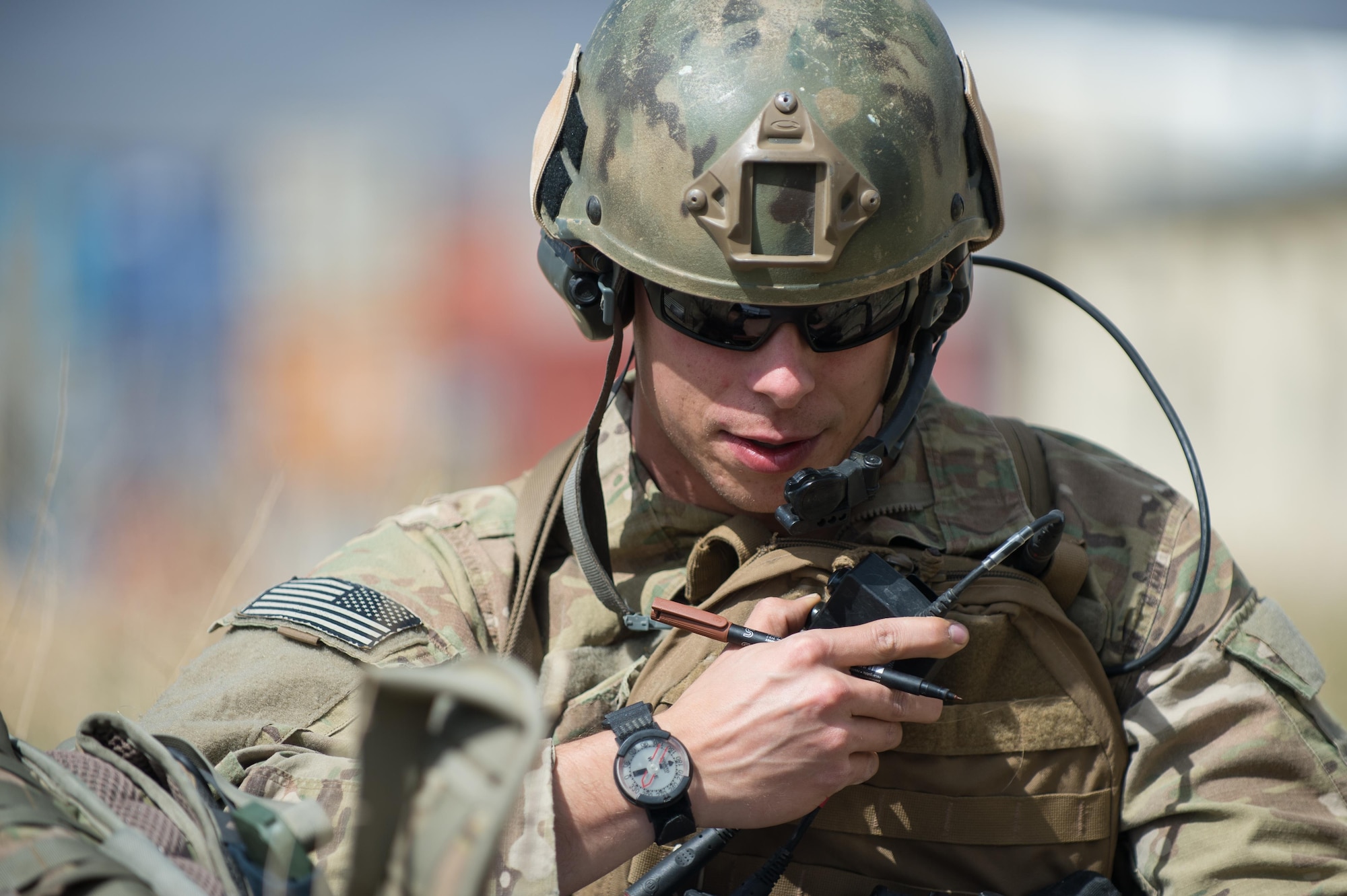 U.S. Air Force Senior Airman Grant Haefke, a Joint Terminal Attack Controller qualified Tactical Air Control Party Airman assigned to the 817th Expeditionary Air Support Operations Squadron, talks to an F-16 Fighting Falcon aircraft pilot during a mission at an Afghan National Army combat outpost in Afghanistan, June 23, 2015.  Haefke was supporting Soldiers with the 3rd Battalion, 187th Infantry Regiment (Iron Rakkasans), 101st Airborne Division (Air Assault) during a NATO Resolute Support Train Advise Assist Command-Air mission.  (U.S. Air Force photo by Tech. Sgt. Joseph Swafford/Released)
