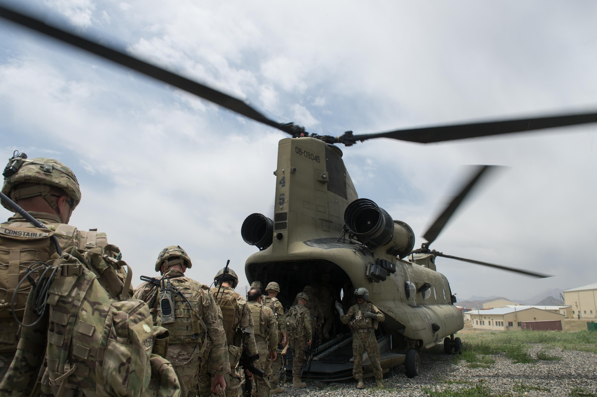 U.S. Soldiers assigned to the 3rd Battalion, 187th Infantry Regiment (Iron Rakkasans), 101st Airborne Division (Air Assault), and Air Force Senior Airman Grant Haefke, a Joint Terminal Attack Controller qualified Tactical Air Control Party Airman assigned to the 817th Expeditionary Air Support Operations Squadron, enter a U.S. Army CH-47 Chinook helicopter at an Afghan National Army combat outpost in Afghanistan, June 23, 2015. The Soldiers and Haefke supported a NATO Resolute Support Train Advise Assist Command-Air mission.  (U.S. Air Force photo by Tech. Sgt. Joseph Swafford/Released)