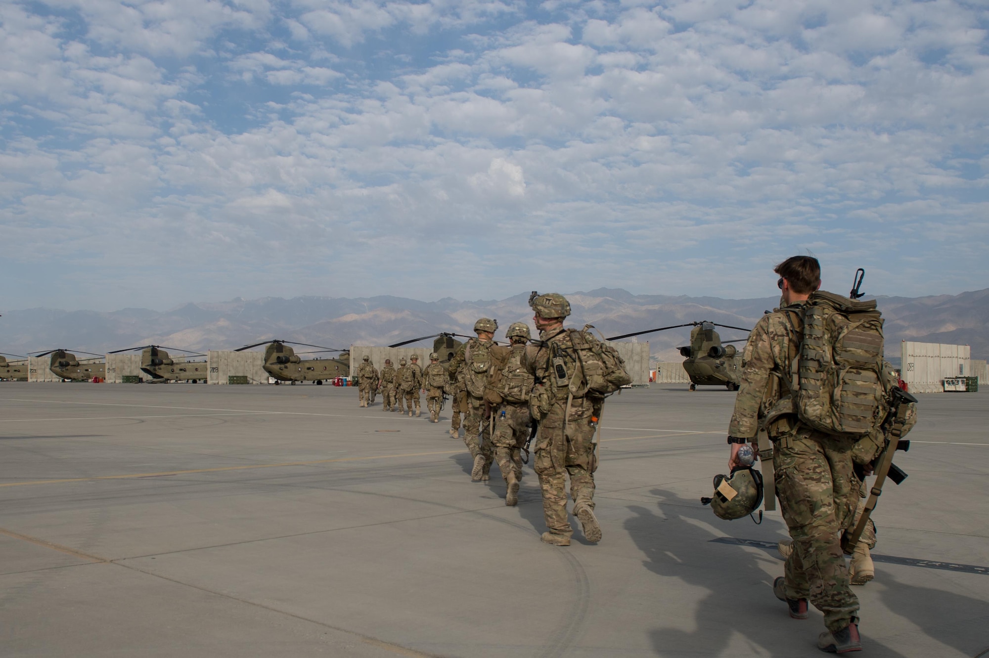 U.S. Air Force Senior Airman Grant Haefke, a Joint Terminal Attack Controller qualified Tactical Air Control Party Airman assigned to the 817th Expeditionary Air Support Operations Squadron, and Soldiers assigned to the 3rd Battalion, 187th Infantry Regiment (Iron Rakkasans), 101st Airborne Division (Air Assault) walk to an Army CH-47 Chinook helicopter before leaving Bagram Airfield, Afghanistan, June 23, 2015.  Haefke and the Soldiers supported a NATO Resolute Support Train Advise Assist Command-Air mission.  (U.S. Air Force photo by Tech. Sgt. Joseph Swafford/Released)