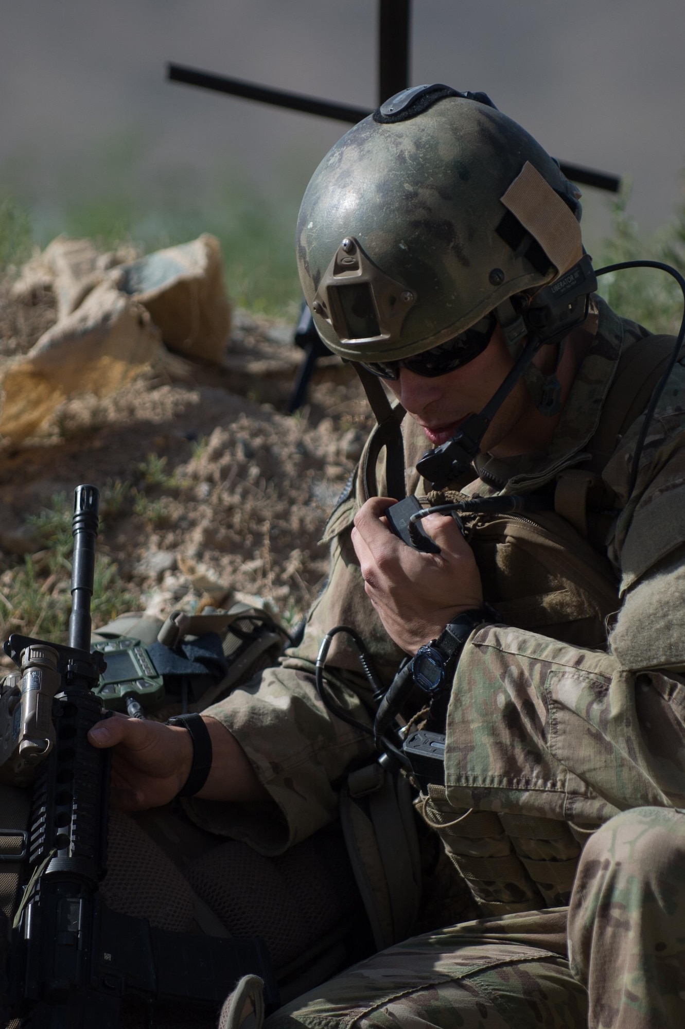 U.S. Air Force Senior Airman Grant Haefke, a Joint Terminal Attack Controller qualified Tactical Air Control Party Airman assigned to the 817th Expeditionary Air Support Operations Squadron, talks to an F-16 Fighting Falcon aircraft pilot during a mission at an Afghan National Army combat outpost in Afghanistan, June 23, 2015.  Haefke was supporting Soldiers with the 3rd Battalion, 187th Infantry Regiment (Iron Rakkasans), 101st Airborne Division (Air Assault) during a NATO Resolute Support Train Advise Assist Command-Air mission.  (U.S. Air Force photo by Tech. Sgt. Joseph Swafford/Released)