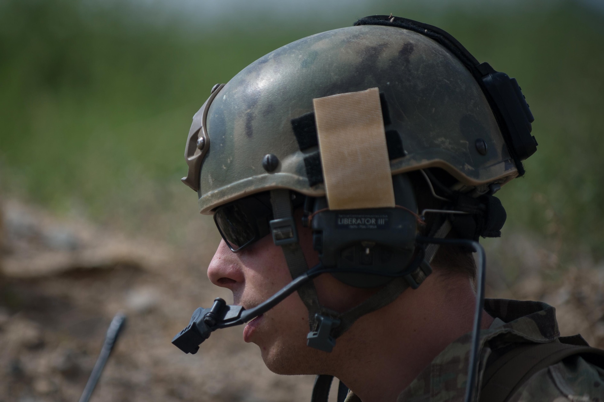 U.S. Air Force Senior Airman Grant Haefke, a Joint Terminal Attack Controller qualified Tactical Air Control Party Airman assigned to the 817th Expeditionary Air Support Operations Squadron, talks to an F-16 Fighting Falcon aircraft pilot during a mission at an Afghan National Army combat outpost in Afghanistan, June 23, 2015.  Haefke was supporting Soldiers with the 3rd Battalion, 187th Infantry Regiment (Iron Rakkasans), 101st Airborne Division (Air Assault) during a NATO Resolute Support Train Advise Assist Command-Air mission.  (U.S. Air Force photo by Tech. Sgt. Joseph Swafford/Released)