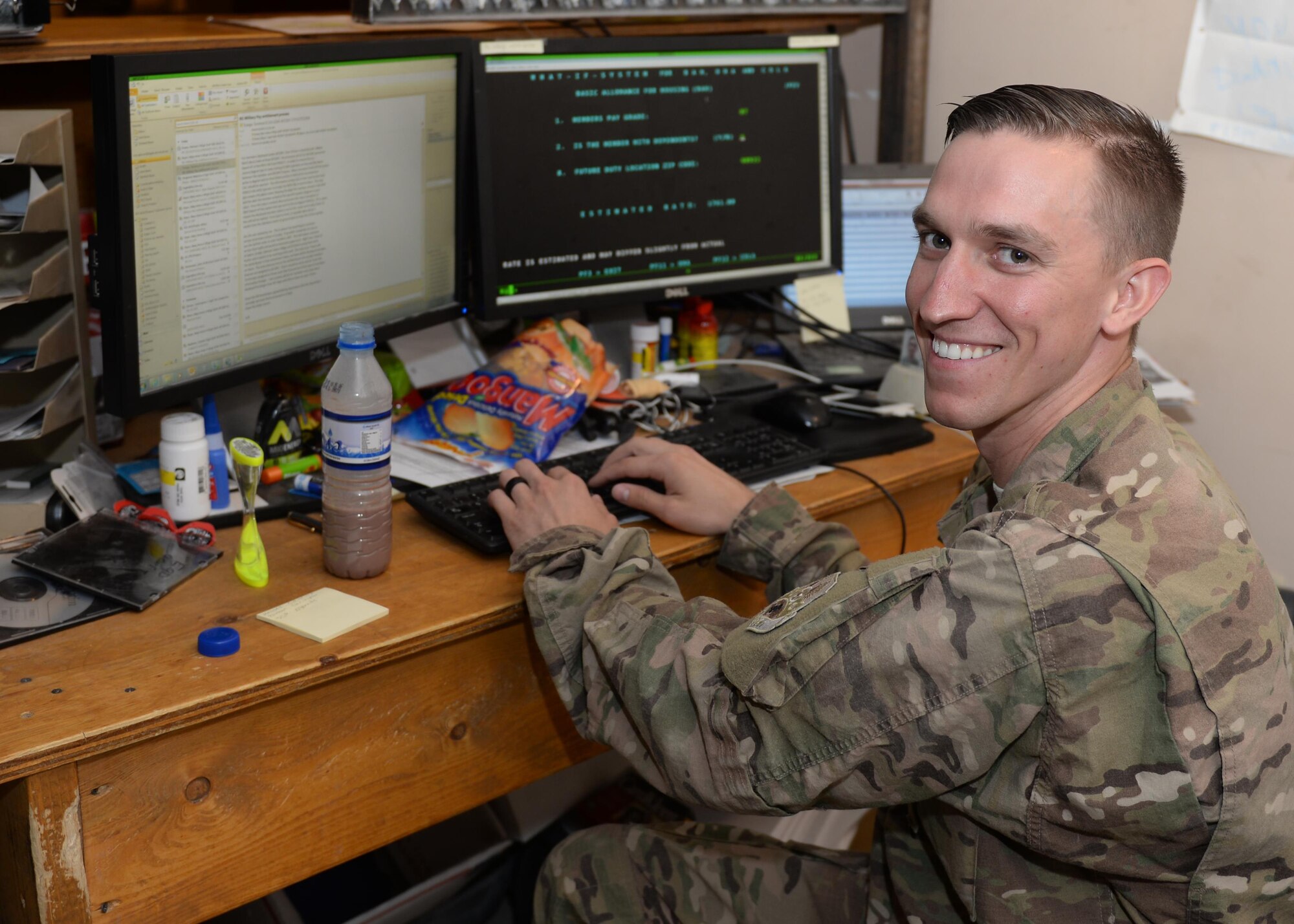 U.S. Air Force Senior Airman Corey Gibson, 455th Air Expeditionary Wing Finance Management customer service technician, pauses for a photo while working June 24, 2015, at Bagram Airfield, Afghanistan. Gibson is the only finance customer service technician in Afghanistan and ensures all Bagram Active Duty, Reserve and Guard Airmen as well as U.S. civilian members are financially set during their deployment here. (U.S. Air Force photo by Senior Airman Corey Gibson/Released)