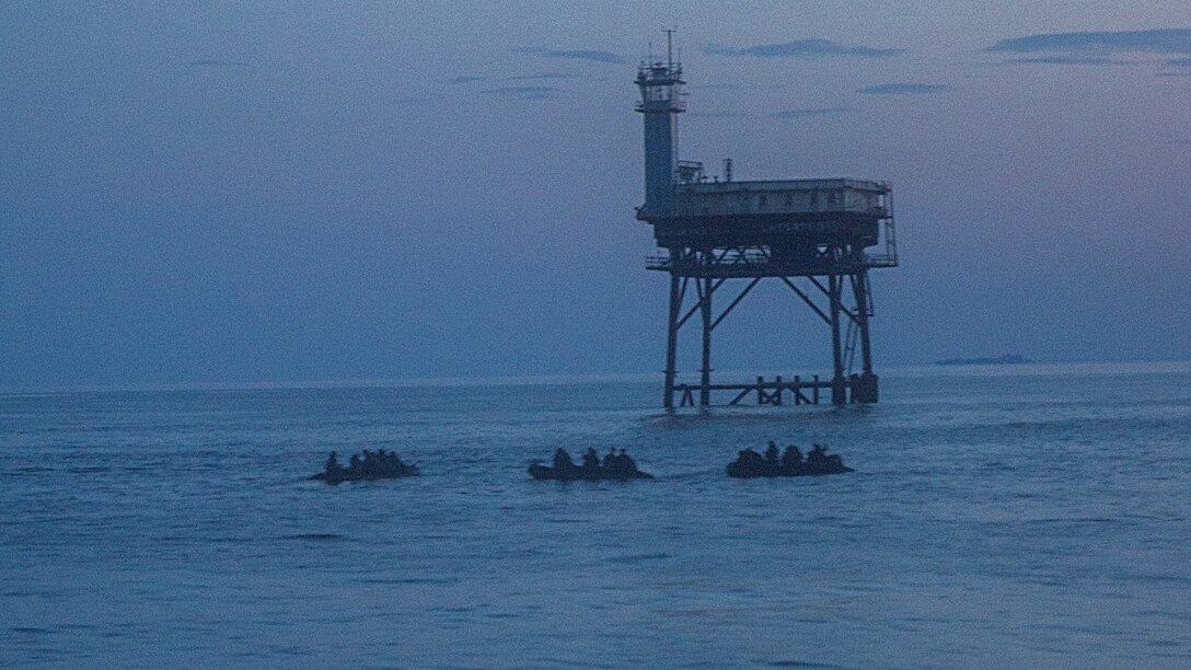 Three Zodiac boats with Marines from Alpha Company, 2nd Reconnaissance Battalion, 2nd Marine Division group up during soft-duct insertion operations aboard Joint Expeditionary Base Little Creek-Fort Story, Va., June 16, 2105. Marines with the company departed Marine Corps Air Station New River, North Carolina in two CH-53E Super Stallion helicopters, for a four-day, full-mission profile where the Marines would gather intelligence from opposition forces.