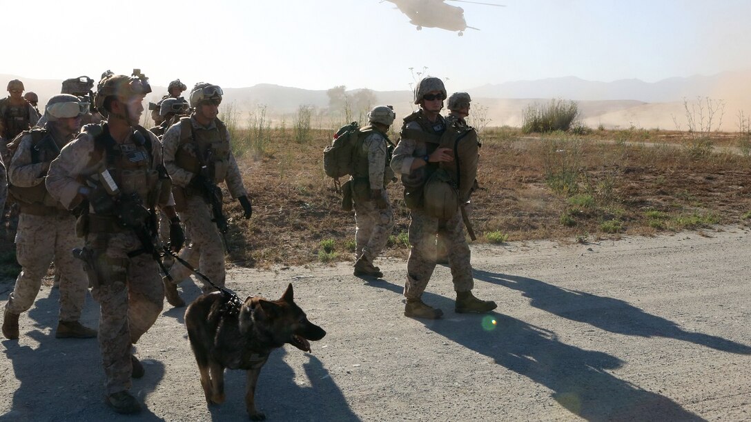 Marines with 1st Explosive Ordnance Disposal Company, 1st Marine Logistics Group, I Marine Expeditionary Force, disembark a CH-53 Super Stallion helicopter and move to their mission objective, where they were tasked with destroying ordnance fired at a foreign embassy during a training exercise aboard Camp Pendleton, Calif., June 17, 2015. The Marines of 1st EOD Co. are preparing for an upcoming deployment with Special Purpose Marine Air Ground – Crisis Response – Central Command, where they will participate in a fast reaction force role.