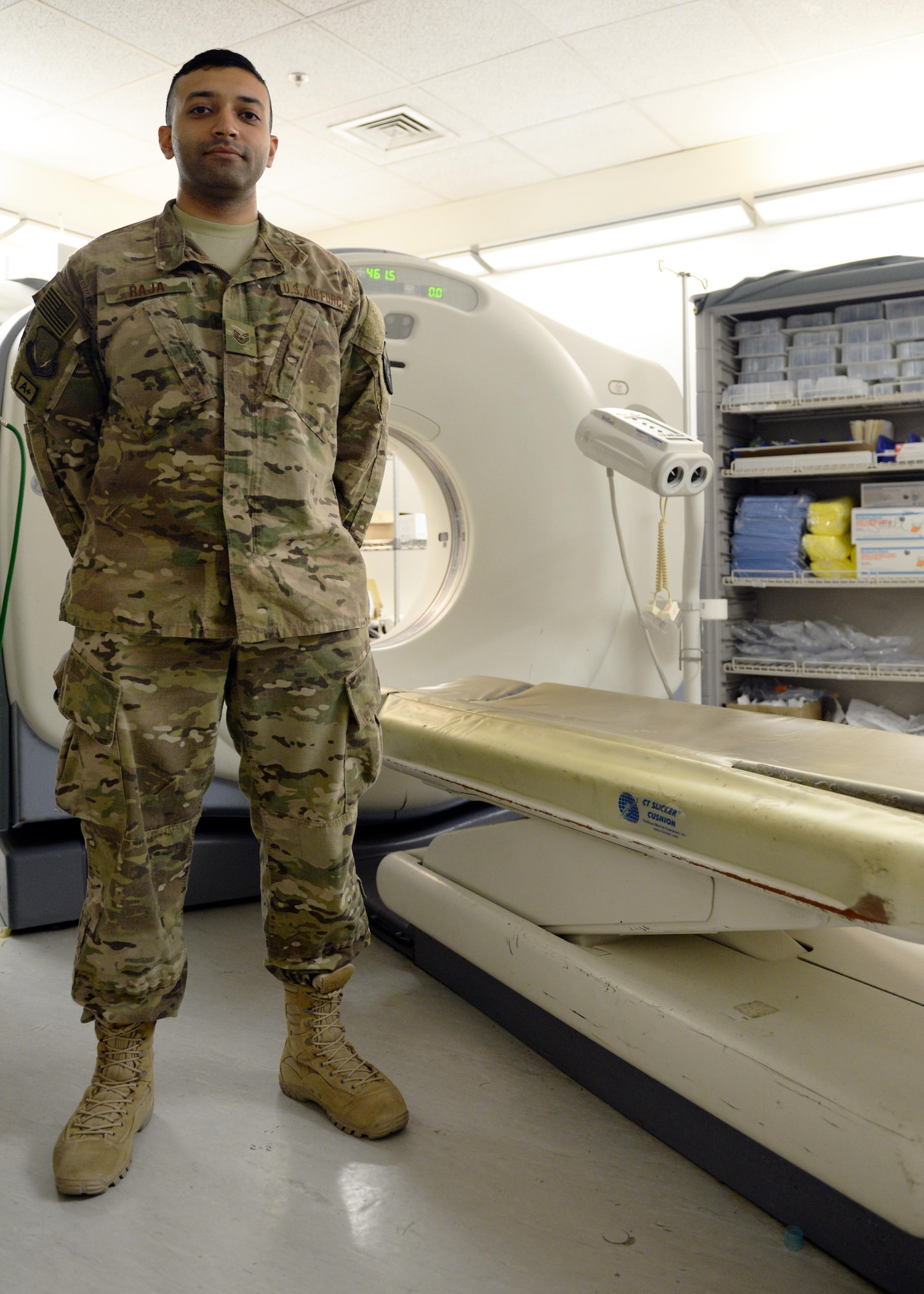 U.S. Air Force Staff Sgt. Asam Raja, 455th Medical Operations Squadron diagnostic imagery technician, poses for a photo in the radiology lab June 10, 2015, at Bagram Airfield, Afghanistan. Raja is part of the “1000s of Hands” of 455th AEW Airmen who are critical to the wing’s mission to generate and sustain airpower on the combat frontier of Afghanistan for NATO’s Resolute Support mission and Operation Freedom’s Sentinel. The “1000s of Hands” project highlights Vulture Airmen who have a hand in delivering a blanket of steel, technology and courage to protect the force in the field and support Afghan National Defense and Security Forces. (U.S. Air Force photo by Senior Airman Cierra Presentado/Released)