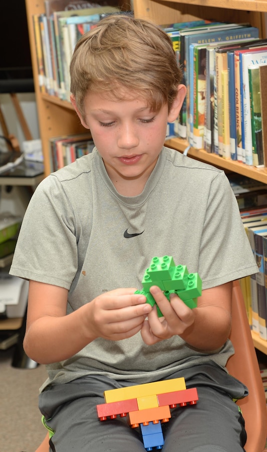 A youngster begins building during the first Lego® Club at Marine Corps Logistics Base Albany's Library, June 25. Co-hosted by the Library and the Exceptional Family Member Program, the event will be held each month on the fourth Thursday from 10-11 a.m. For more details, call 229-639-5242 or 229-639-5277. 