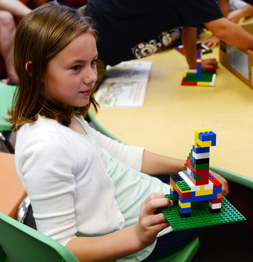 A young participant displays a dinosaur she built during the first Lego® Club at Marine Corps Logistics Base Albany's Library, June 25. Co-hosted by the Library and the Exceptional Family Member Program, the event will be held each month on the fourth Thursday from 10-11 a.m. For more details, call 229-639-5242 or 229-639-5277.