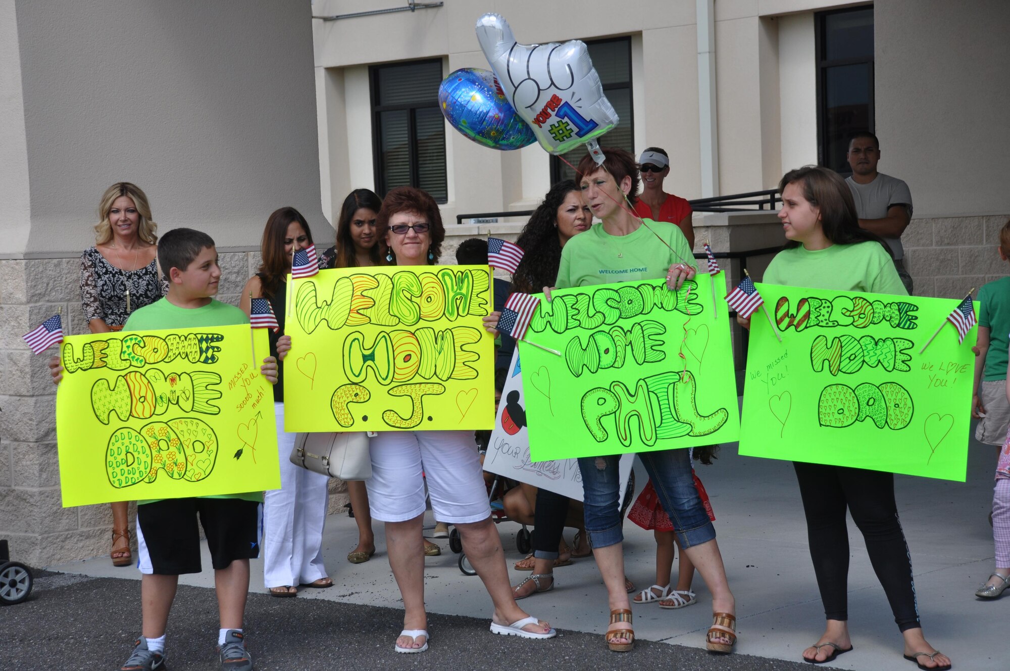 Family members of Master Sgt. Phil Giacalone anxiously wait on the flight line for his return from a recent deployment, June 17, 2015, at MacDill Air Force Base. Members of the 927th Air Refueling Wing recently returned from an extended deployment in Southwest Asia in support of Operation Inherent Resolve. The 927 ARW’s mission is to support the totally integrated mission by extending global reach while providing global air refueling and airlift operations. (U.S. Air Force photo by Staff Sgt. Adam C. Borgman)