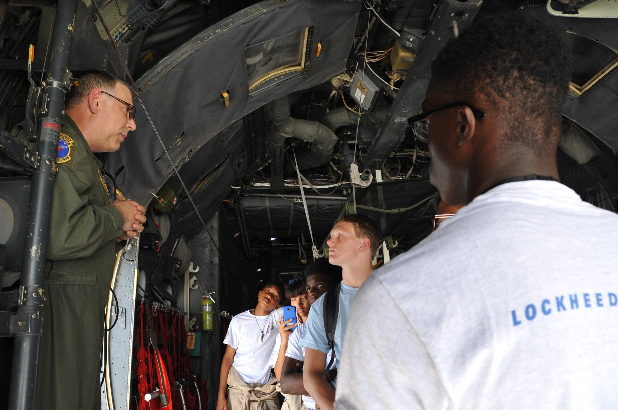 Lt. Col. David Rodberg, 94th Aeromedical Evacuation Squadron flight commander, provides Tuskegee Airmen Aviation Career Training Cadets background information C-130 Hercules capabilities and mission requirements at Dobbins Air Reserve Base, Ga. on June 25, 2015.  The tours are part of a vocation preparation program designed to give youth an opportunity to explore career fields in aviation. (U.S. Air Force photo/Tech. Sgt. Karla V. Lehman)