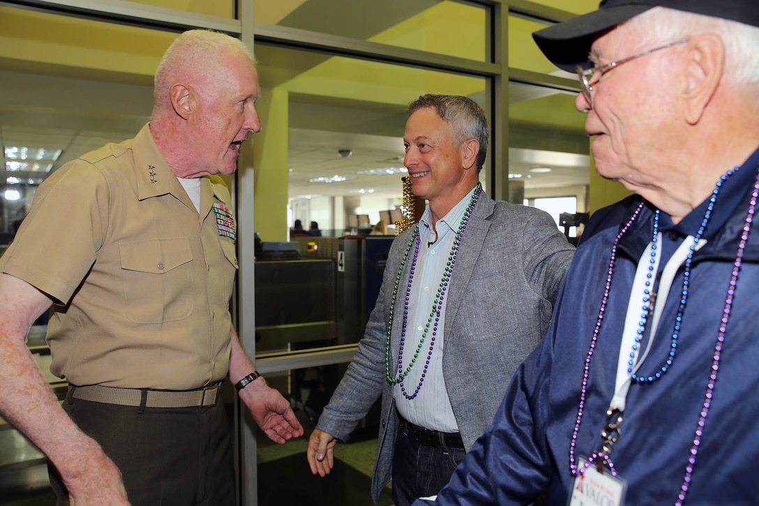 Lt. Gen. Richard P. Mills, (left), greets Academy Award-nominated actor Gary Sinise, upon his arrival to the Louis Armstrong International Airport in New Orleans, June 24, 2015. Sinise traveled to the bayou state with 50 WWII veterans as part of a program organized by the Gary Sinise Foundation to honor them for their service to the country.  Sinise and numerous volunteers escorted the veterans to the WWII Museum after a welcome ceremony held at the airport. 