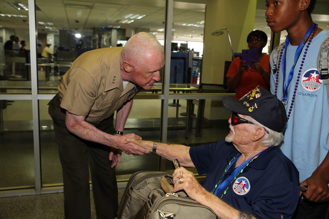 Lt. Gen. Richard P. Mills, (left), the commander of Marine Forces Reserve and Marine Forces North, welcomes a veteran of WWII to New Orleans at the Louis Armstrong International Airport in Kenner, La., June 24, 2015. Mills, along with Marines from his command, and other service members and volunteers, participated in the welcome ceremony organized by the Gary Sinise Foundation. The veterans flew to New Orleans to visit the WWII Museum in downtown New Orleans. 
