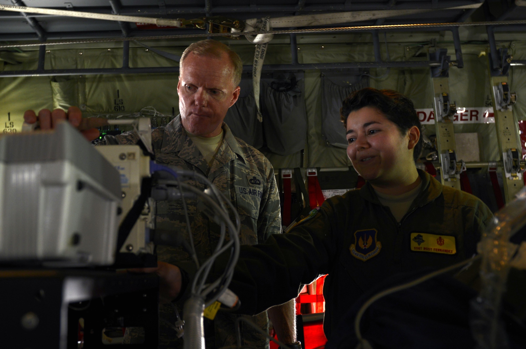Staff Sgt. Rosy Fernandez, an 86th Medical Group respiratory therapist, demonstrates to Chief Master Sergeant of the Air Force James A. Cody how an injured military member receives care during an air rescue operation June 15, 2015, at Ramstein Air Base, Germany. During his visit, Cody held an all call for Airmen, spoke to senior NCOs and had a tour of Ramstein. (U.S. Air Force photo/Airman 1st Class Tryphena Mayhugh)