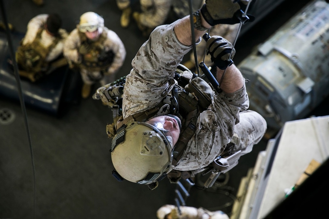 ARABIAN SEA (June 23, 2015) U.S. Marine Sgt. Jesse Kimble practices climbing a caving ladder aboard the USS Essex (LHD 2). Kimble is a member of the 15th Marine Expeditionary Unit’s Maritime Raid Force. This skill is important for the Marines, who may need to climb onto a ship or hovering aircraft during training or operations. The 15th MEU is embarked on the Essex Amphibious Ready Group and deployed to maintain regional security in the U.S. 5th Fleet area of operations. (U.S. Marine Corps photo by Cpl. Anna Albrecht Released)