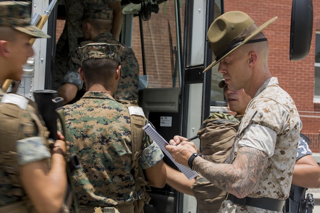 Senior Drill Instructor Gunnery Sgt. Christopher S. Miles ensures accountability of Lima Company, 3rd Recruit Training Battalion, recruits during a hurricane evacuation exercise June 24, 2015. The exercise simulated the efforts needed to evacuate permanent personnel, recruits and equipment. After the week-long exercise, officials will review the outcome and apply any necessary changes to ensure Parris Island can continue making Marines regardless of what mother nature throws at the Lowcountry. Miles, 33, is from Lily, Ky.