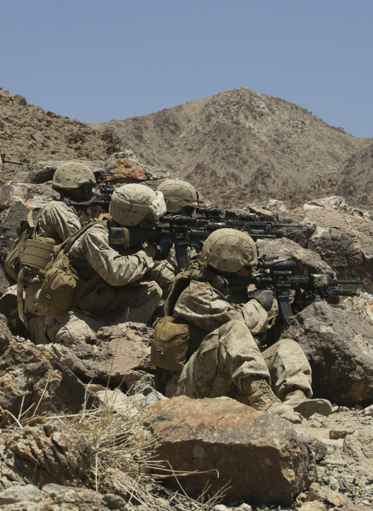 MARINE CORPS AIR GROUND COMBAT CENTER TWENTYNINE PALMS, Calif. – Marines with Company L, 3rd Battalion, 25th Marine Regiment, 4th Marine Division, Marine Forces Reserve, shoot down range at simulated targets in a live fire exercise during the Integrated Training Exercise 4-15 at Marine Corps Air Ground Combat Center Twentynine Palms, Calif., June 14, 2015. ITX allows Reserve Marines to train in realistic environments under realistic conditions, which helps Marines maintain a high level of proficiency and readiness for worldwide deployment. (U.S Marine Corps photo by Cpl. Ian Ferro)