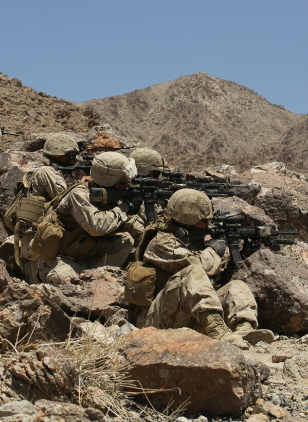 MARINE CORPS AIR GROUND COMBAT CENTER TWENTYNINE PALMS, Calif. – Marines with Company L, 3rd Battalion, 25th Marine Regiment, 4th Marine Division, Marine Forces Reserve, shoot down range at simulated targets in a live fire exercise during the Integrated Training Exercise 4-15 at Marine Corps Air Ground Combat Center Twentynine Palms, Calif., June 14, 2015. ITX allows Reserve Marines to train in realistic environments under realistic conditions, which helps Marines maintain a high level of proficiency and readiness for worldwide deployment. (U.S Marine Corps photo by Cpl. Ian Ferro)