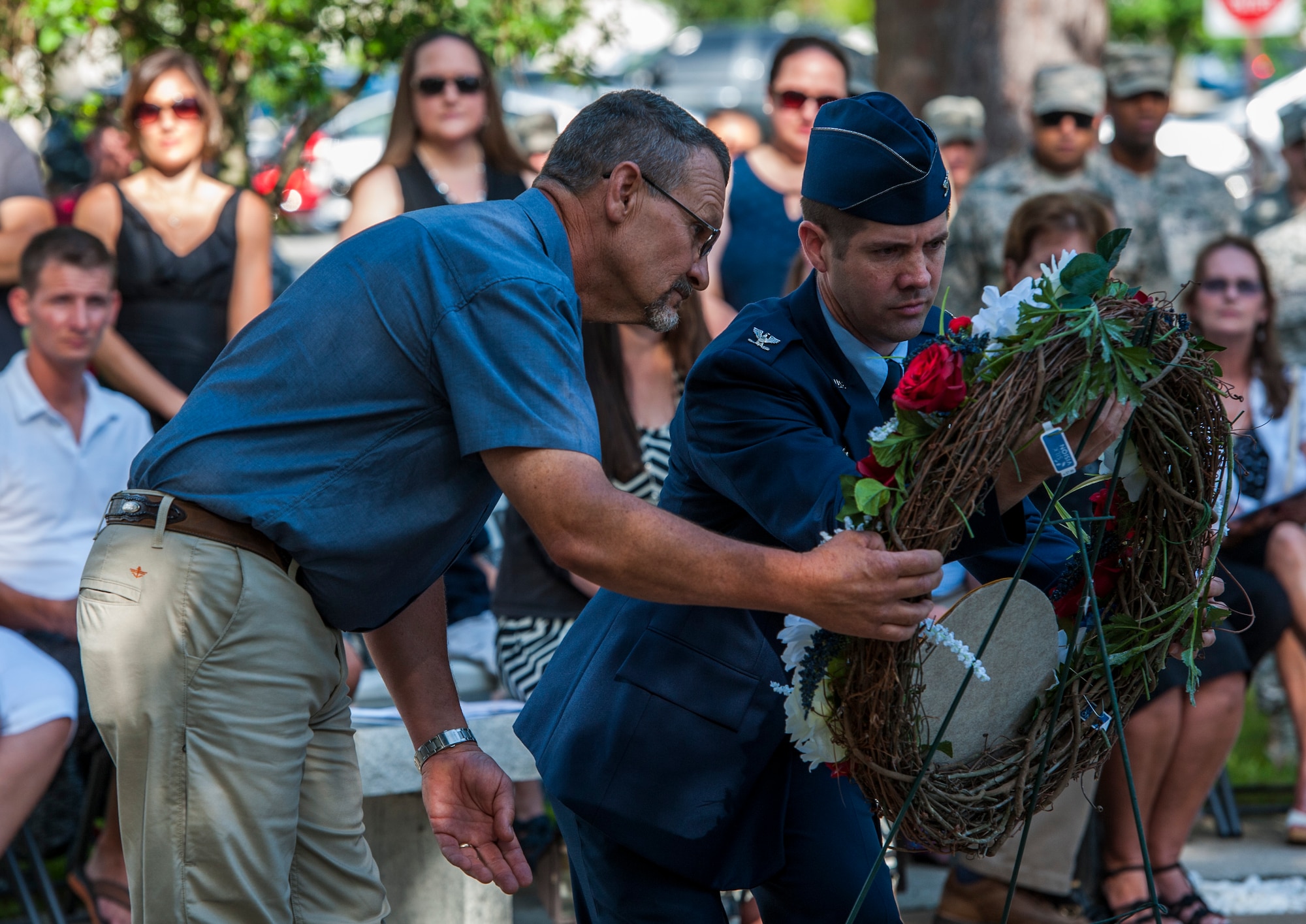 Tech. Sgt. (retired) David Westrup, left, 58th Fighter Squadron crew chief, and Col. Lance Pilch, 33rd Fighter Wing commander, place a wreath during the 19th anniversary Khobar Tower memorial ceremony, June 25, 2015, on Eglin Air Force Base, Florida. On June 25, 1996, a truck-bomb was detonated adjacent to Khobar Tower in Dhahran, Saudi Arabia, that resulted in 400 injured U.S. and international military and civilian members. (U.S. Air Force photo/Staff Sgt. Marleah Robertson)