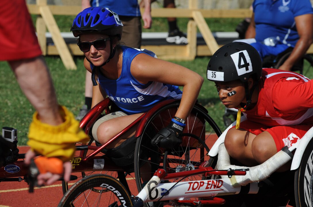 Capt. Christy Wise, an Air Force wounded warrior athlete, competes in the wheelchair 100-yard dash during the 2015 Department Of Defense Warrior Games in Quantico, Va., June 23, 2015. The Warrior Games features athletes from throughout the Defense Department who compete in Paralympic-style events for their respective military branches. (U.S. Air Force photo /Senior Airman Hailey Haux)