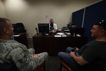Kelly Schell, 1st Special Operations Force Support Squadron human resource assistant, assists customers at the military personnel section, June 25, 2015, at Hurlburt Field, Fla. The customer support section provides and updates ID cards, Defense Enrollment Eligibility Reporting System (DEERS), family status, service members' group life insurance, leave web requests, passports/visas and casualty assistance and survivor benefits. (U.S. Air Force photo by Airman 1st Class Ryan Conroy/Released)