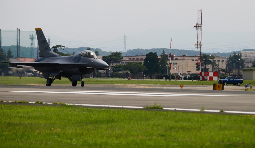 A U.S. Air Force F-16 Fighting Falcon from Misawa Air Base, Japan, taxis down the runway during an aircraft arresting system test certification at Yokota Air Base, Japan, June 24, 2015. The annual certification check's the integrity of the barriers hydraulic system and the system as a whole. (U.S. Air Force photo by Senior Airman David Owsianka/Released)