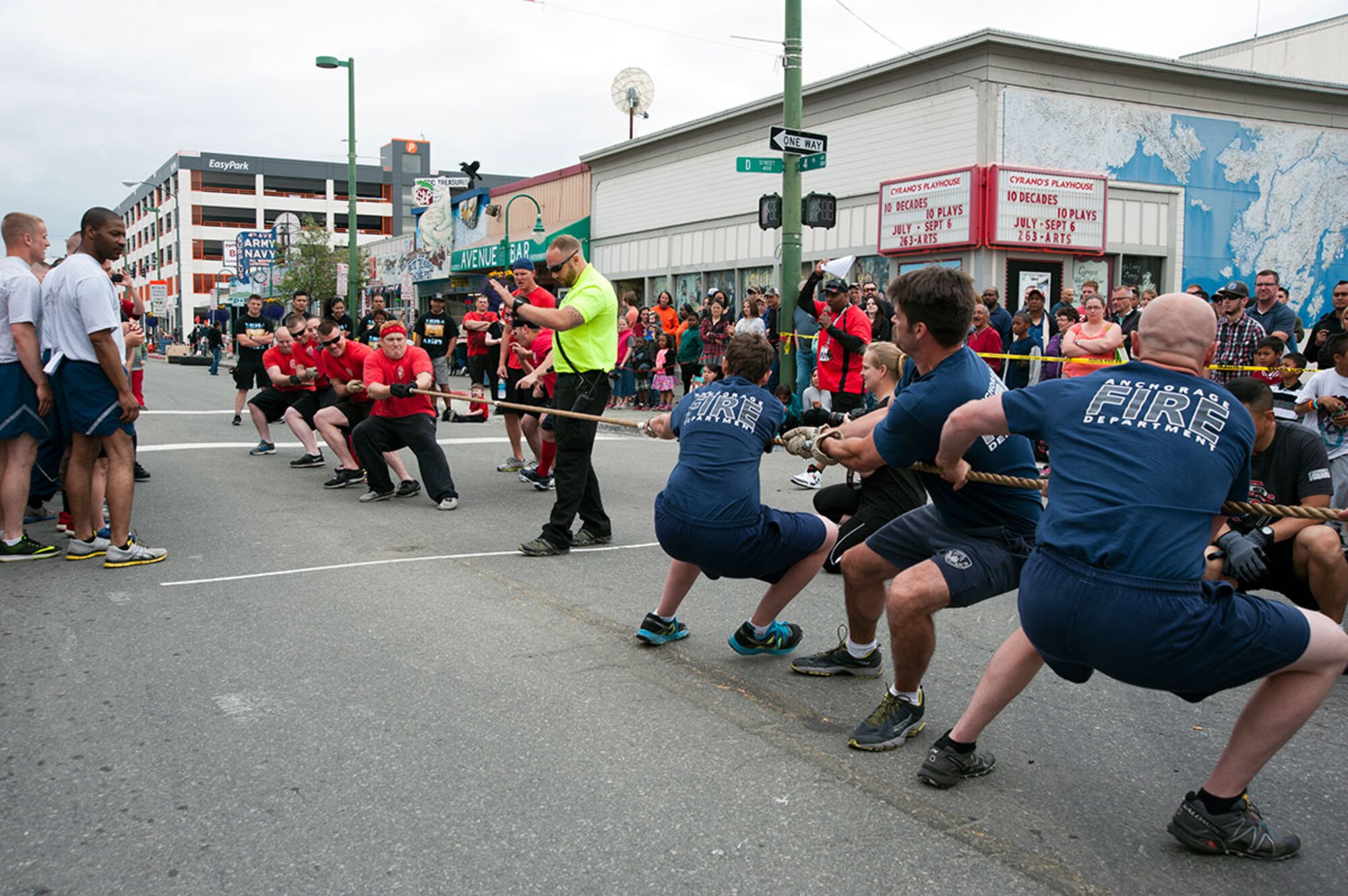 Firefighters from the 673rd Civil Engineer Squadron face off with members of the Anchorage Fire Department in tug-o-war at the 2015 Hero Games in downtown Anchorage, June 20, 2015. It was the last event which determined the winners of the 2015 Hero Games. (U.S. Air Force photo by Senior Airman Tammie Ramsouer/Released)
