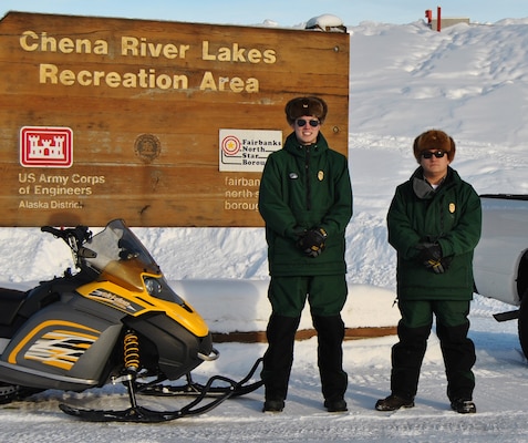 Jacob Kresel (right), senior park ranger and natural resource specialist, and Cole Van Beusekom (left), park ranger, are easy to recognize with their forest green uniforms, “Smokey bear” hats and Corps castle belt buckles. The opportunity to work at the Chena Project in North Pole is a fulfilling vocation for both.