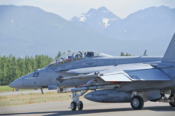 A U.S. Navy F/A-18F Super Hornet from the Air Test Squadron, China Lake, California, taxis to take off during Exercise Northern Edge at Joint Base Elmendorf-Richardson, Alaska, June 18, 2015. Northern Edge 15 is Alaska’s premier joint training exercise designed to practice operations, techniques and procedures as well as enhance interoperability among the services. Thousands of participants from all services, from active duty, Reserve and National Guard units, are involved. (U.S. Air Force photo by Staff Sgt. William Banton/Released)‪