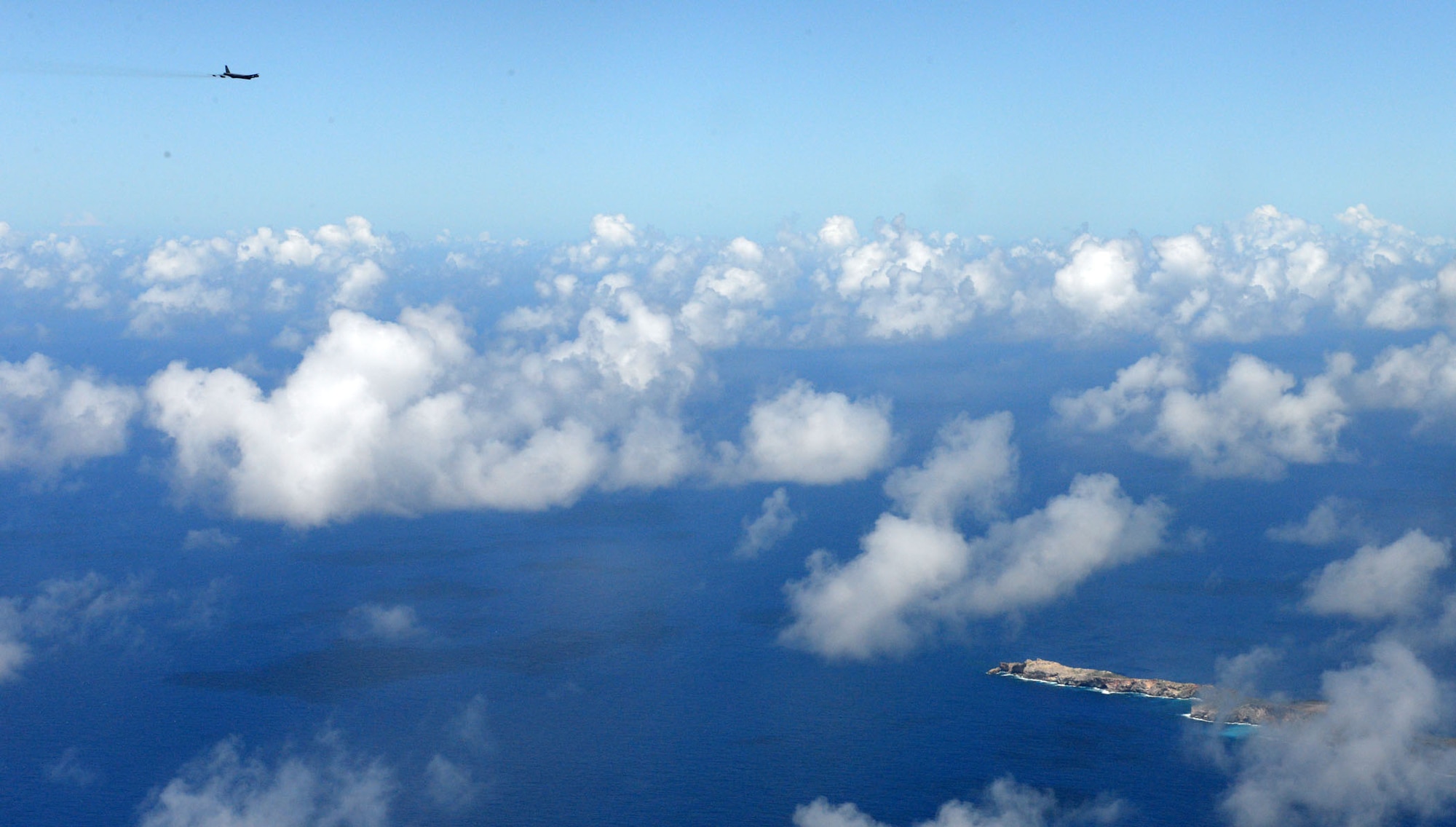 A U.S. Air Force B-52 Stratofortress from the 20th Expeditionary Bomb Squadron, prepares to drop the final M117 bomb in the Pacific Air Force’s inventory June 26, 2015, on an uninhabited island off the coast of Guam. Dropping the final M117 in the PACAF is a small part of U.S. Pacific Command’s Continuous Bomber Presence which was established at Andersen in 2004. (U.S. Air Force photo by Airman 1st Class Joshua Smoot/Released)
