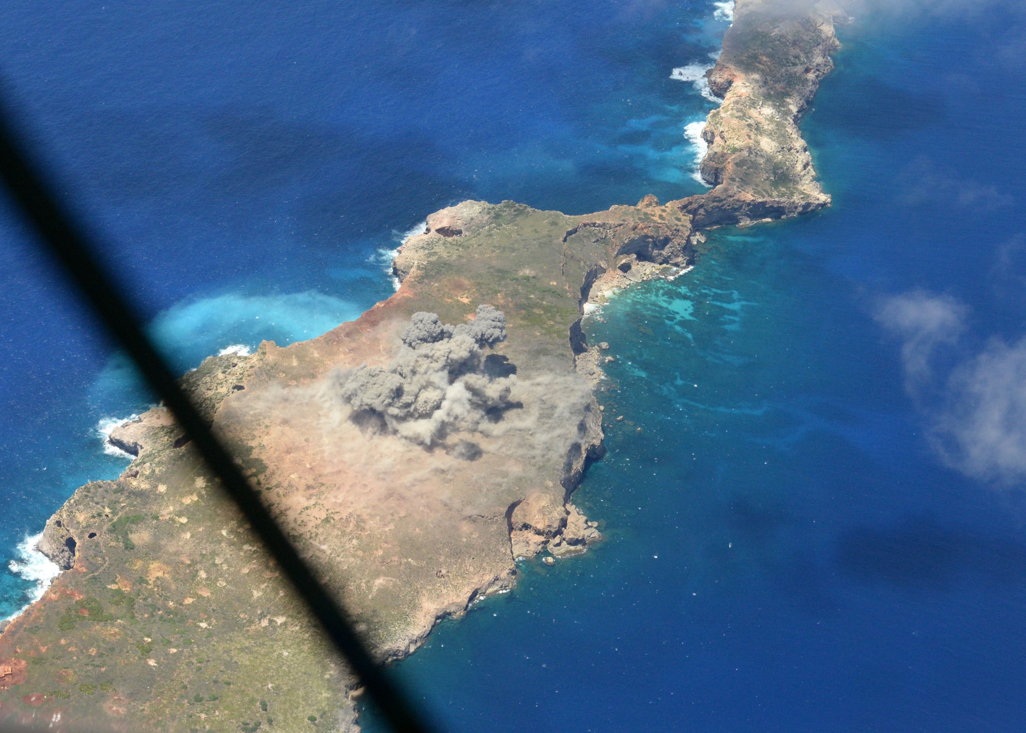 A M117 bomb detonates on an uninhabited island off the coast of Guam June 26, 2015. Airmen from the 20th Expeditionary Bomb Squadron, with the help of 36th Munitions Squadron Airmen, dropped the final M117 bomb in the Pacific Air Force’s inventory as part of a training mission to ensure the security and stability of the Indo-Asia-Pacific region. (U.S. Air Force photo by Airman 1st Class Joshua Smoot/Released) 