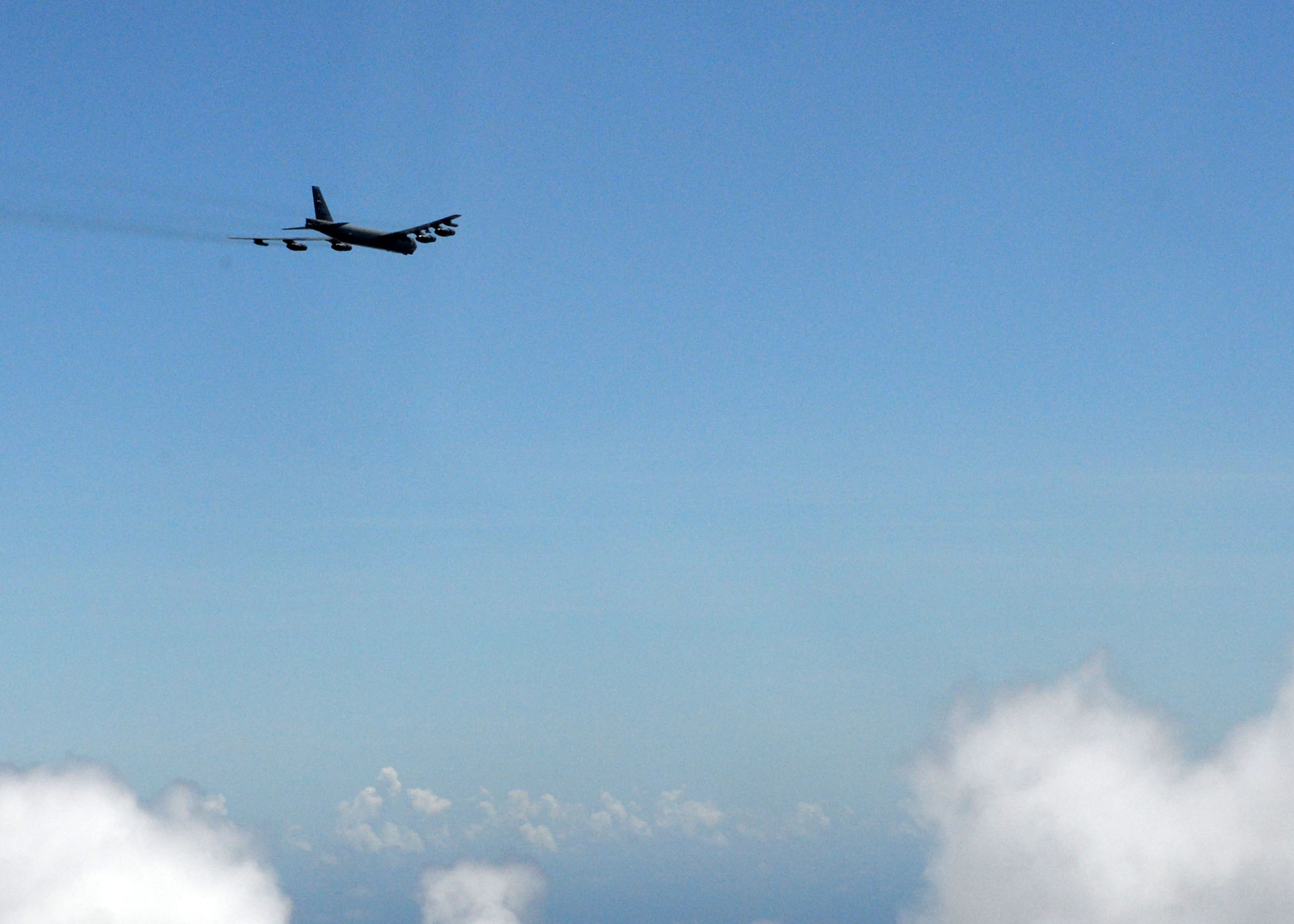 A U.S. Air Force B-52 Stratofortress from the 20th Expeditionary Bomb Squadron, flies over the Pacific Ocean June 26, 2015. Airmen from the 20th EBS dropped the final M117 bomb in the Pacific Air Force’s inventory June 26 on an uninhabited island off the coast of Guam as part of a training mission to ensure the security and stability of the Indo-Asia-Pacific region. (U.S. Air Force photo by Airman 1st Class Joshua Smoot/Released)
