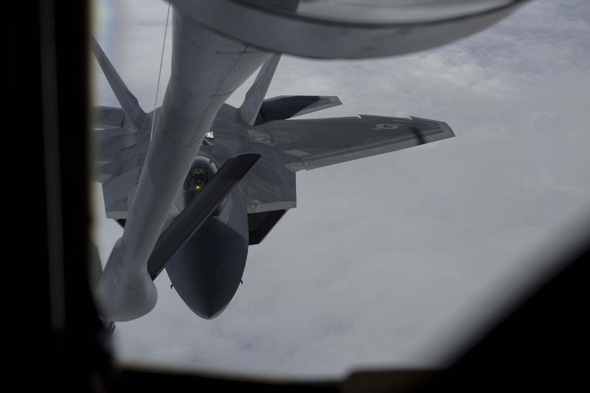 A U.S. Air Force F-22 Raptor prepares to refuel from a KC-135 Stratotanker from the 909th Air Refueling Squadron during Exercise Northern Edge, June 25, 2015. Northern Edge 2015 is Alaska’s premier joint training exercise designed to practice operations, tactics, techniques and procedures as well as enhance interoperability among the services. Thousands of Airmen, Soldiers, Sailors, Marines and Coast Guardsmen from active duty, Reserve and National Guard units, including tankers from the 18th Air Refueling Wing out of Kadena Air Force Base, Japan, are involved. (U.S. Marine Corps photo by Cpl. Thor J. Larson/Released)