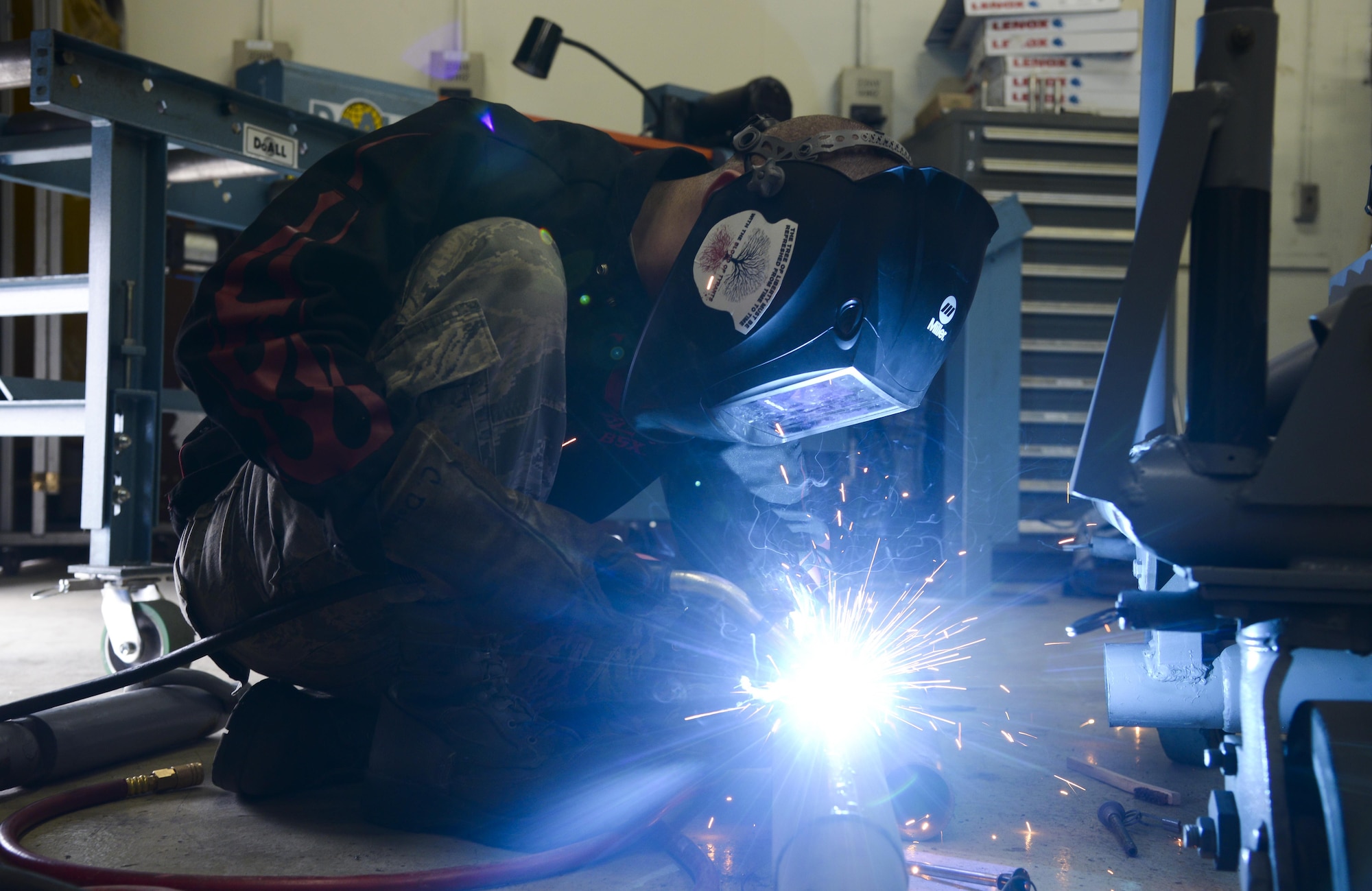 U.S. Air Force Airman 1st Class Curtis Doherty, 374th Maintenance Squadron aircraft metals technology journeyman, welds a hole on a tow bar on a B-1 platform at the fabrication shop at Yokota Air Base, Japan. The metal technology shop performs maintenance work with welding and machining equipment to keep aircraft in flighta nd repair equipment for various base agencies. (U.S. Air Force photo by Senior Airman David Owsianka/Released)