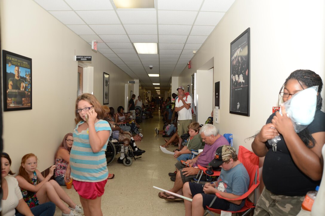 The halls of Building 3500 are filled with visitors from the community after base officials temporarily suspend the Independence Day celebration due to lightning.