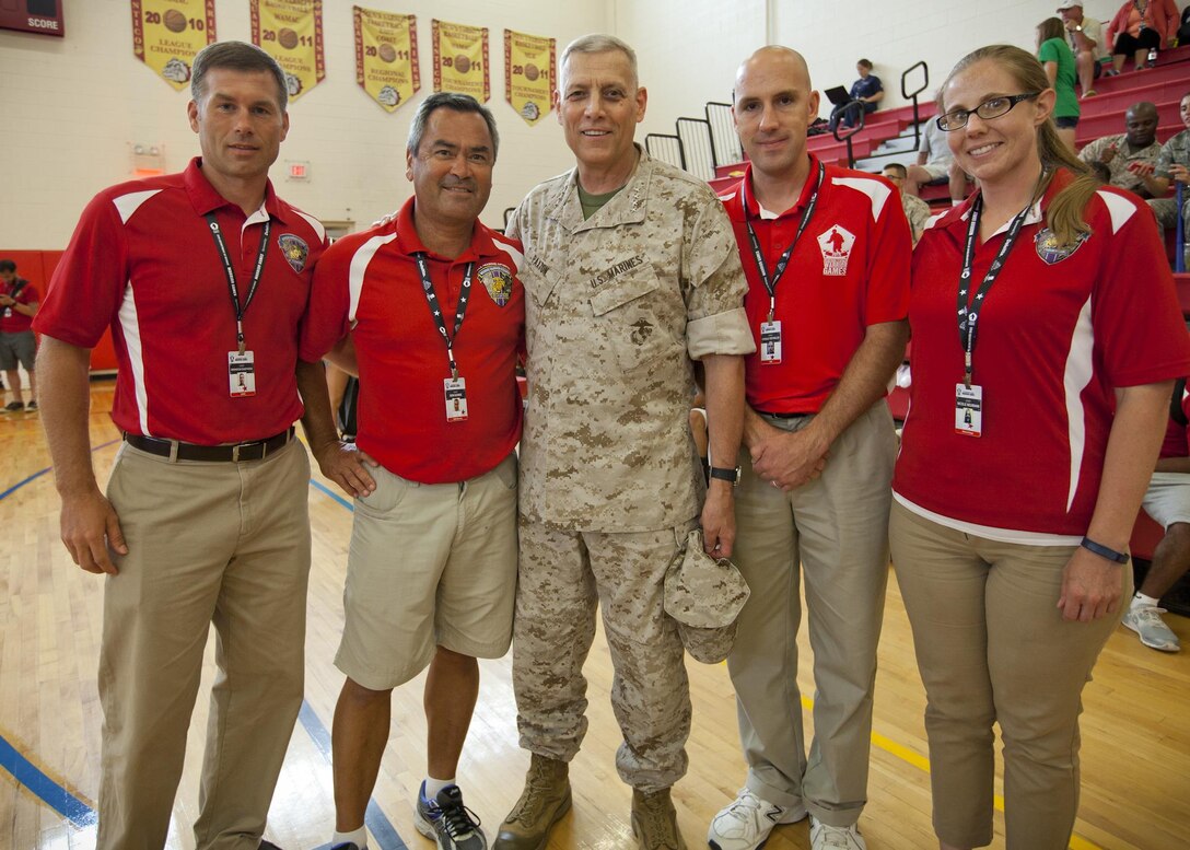The Assistant Commandant of the U.S. Marine Corps, Gen. John M. Paxton, Jr., poses for a photo while visiting competitors, volunteers and medical personnel during the Department of Defense Warrior Games on Marine Corps Base Quantico, Va., June 25, 2015. (U.S. Marine Corps photo by Sgt. Tia Dufour/Released) 