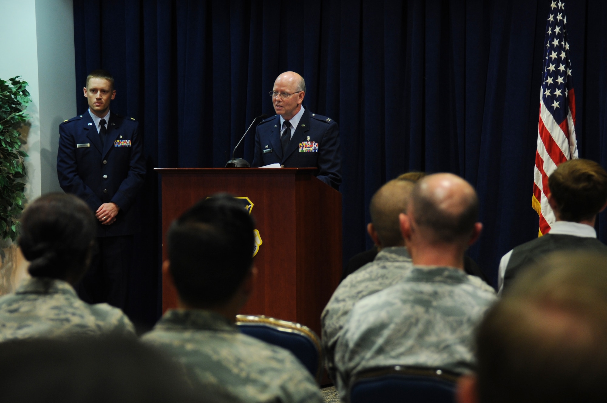 Col. (Dr.) Paul Hoerner, incoming commander of the 61st Medical Squadron at Air Force Space Command's Space and Missile Systems Center, Los Angeles Air Force Base in El Segundo, Calif. address the audience at the Gordon Conference Center during his Assumption of Command ceremony June 26. Hoerner is responsible for ensuring more than 1,200 active duty personnel assigned to SMC and LAAFB are medically fit and ready for contingency (natural disasters and wartime) operations. Additionally, he commands a staff of 178 active duty, government civilians and contract medical staff providing care for more than 171,000 eligible patients across the greater Los Angeles metropolitan area. (U.S. Air Force photo/Van Ha) 